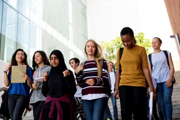 diverse-group-students-walking-school